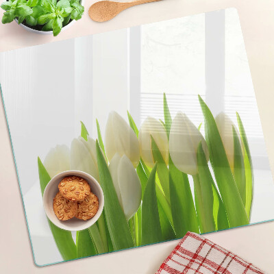 Tábua para cozinha Tulipas em um fundo de folhas verdes