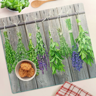 Tábua para cozinha Ervas secas em um fundo de madeira