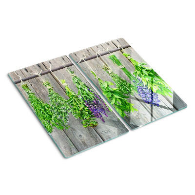 Tábua para cozinha Ervas secas em um fundo de madeira