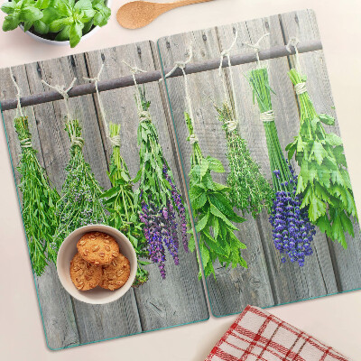 Tábua para cozinha Ervas secas em um fundo de madeira