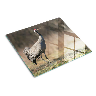 Tábua para corte Um guindaste tendo como pano de fundo uma paisagem