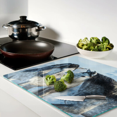 Tábua para corte Cavalos em uma paisagem de inverno