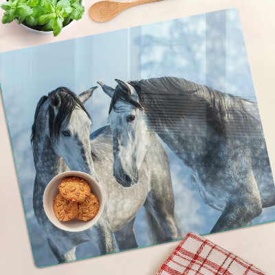 Tábua para corte Cavalos em uma paisagem de inverno