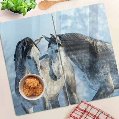 Tábua para corte Cavalos em uma paisagem de inverno