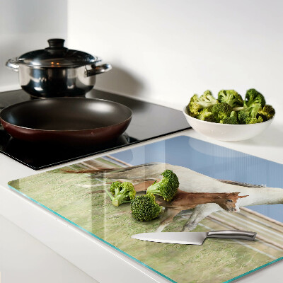 Tábua para corte Um cavalo com um potro em um prado