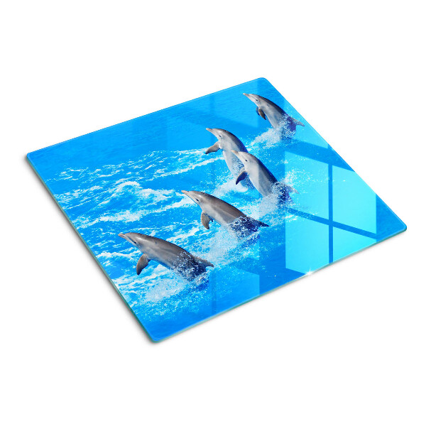 Tábua para corte Golfinhos saltando sobre ondas
