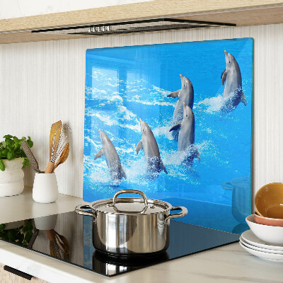 Tábua para corte Golfinhos saltando sobre ondas