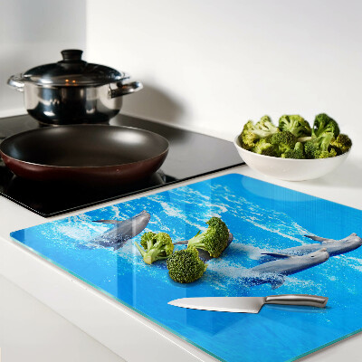 Tábua para corte Golfinhos saltando sobre ondas