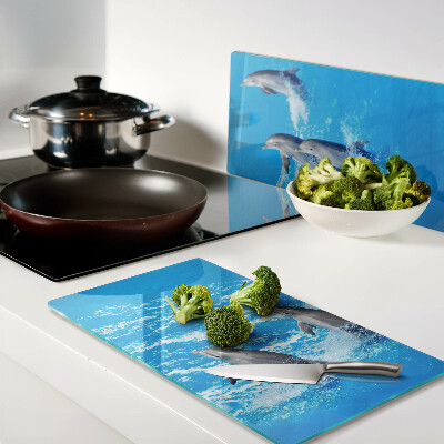 Tábua para corte Golfinhos saltando sobre ondas