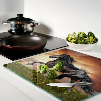 Tábua para corte Um cavalo tendo como pano de fundo o pôr do sol