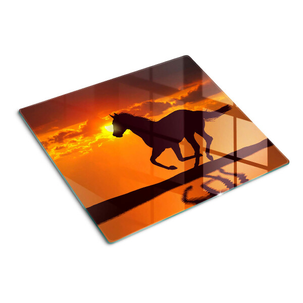 Tábua para cozinha Um cavalo tendo como pano de fundo o pôr do sol
