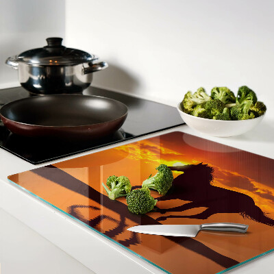 Tábua para cozinha Um cavalo tendo como pano de fundo o pôr do sol