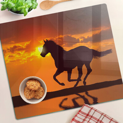 Tábua para cozinha Um cavalo tendo como pano de fundo o pôr do sol