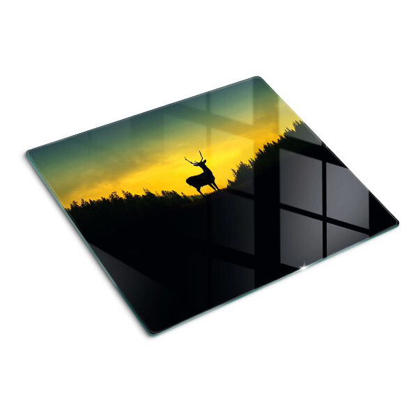 Tábua para corte Veado tendo como pano de fundo o pôr do sol