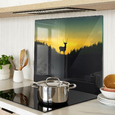 Tábua para corte Veado tendo como pano de fundo o pôr do sol