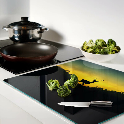 Tábua para corte Veado tendo como pano de fundo o pôr do sol