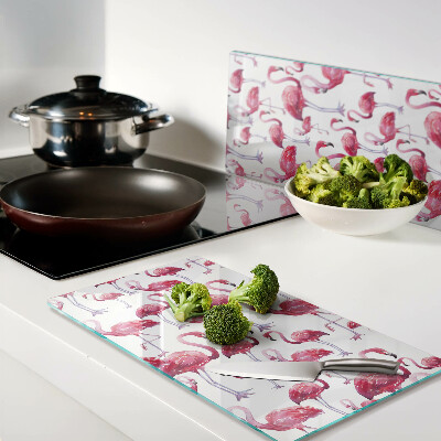 Tábua para corte Flamingos em um fundo branco