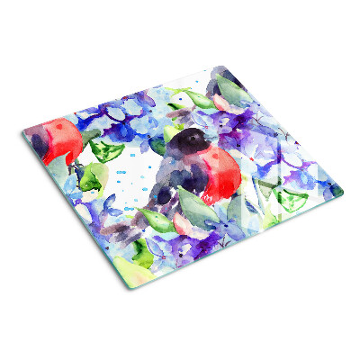 Tábua para corte Um pássaro contra um fundo de flores