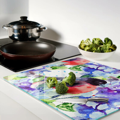 Tábua para corte Um pássaro contra um fundo de flores