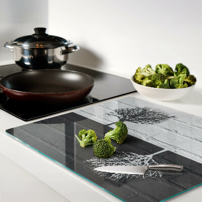 Tábua para corte Uma árvore contra um fundo de tijolos