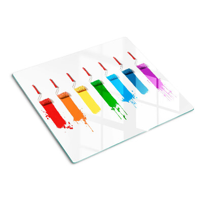 Tábua para corte Um arco-íris de tintas em pincéis