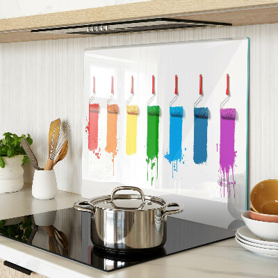 Tábua para corte Um arco-íris de tintas em pincéis