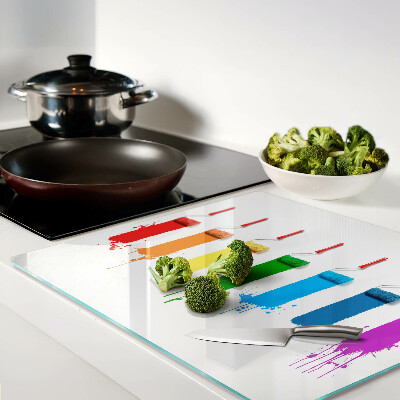 Tábua para corte Um arco-íris de tintas em pincéis