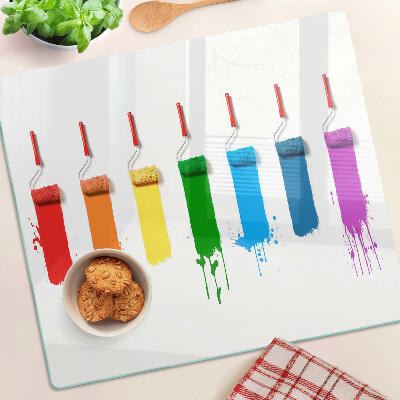 Tábua para corte Um arco-íris de tintas em pincéis