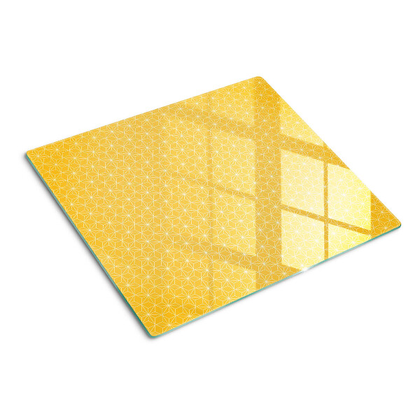 Tábua para corte Flor da vida em um fundo amarelo