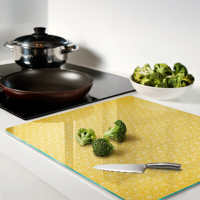 Tábua para corte Flor da vida em um fundo amarelo