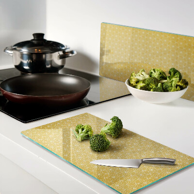 Tábua para corte Flor da vida em um fundo amarelo