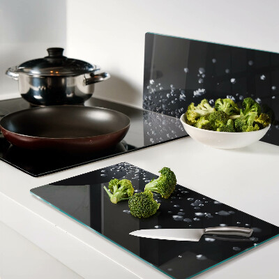 Tábua para corte Bolhas de cristal em um fundo preto