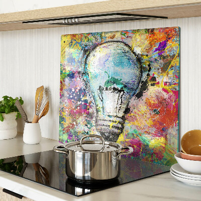 Tábua para corte Lâmpada em um fundo colorido