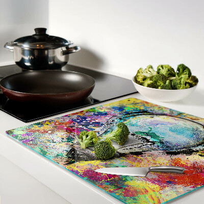 Tábua para corte Lâmpada em um fundo colorido