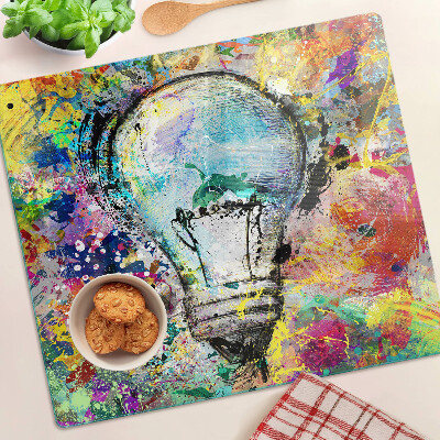 Tábua para corte Lâmpada em um fundo colorido