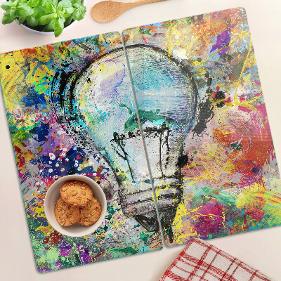 Tábua para corte Lâmpada em um fundo colorido