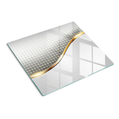 Tábua para corte Uma onda dourada sobre um fundo de pontos