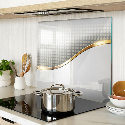 Tábua para corte Uma onda dourada sobre um fundo de pontos