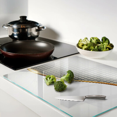 Tábua para corte Uma onda dourada sobre um fundo de pontos