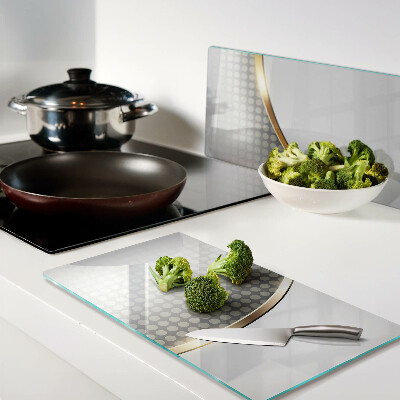 Tábua para corte Uma onda dourada sobre um fundo de pontos