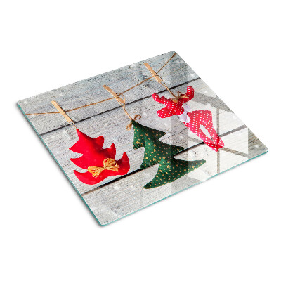 Tábua para cozinha Decorações de Natal em um fundo de madeira