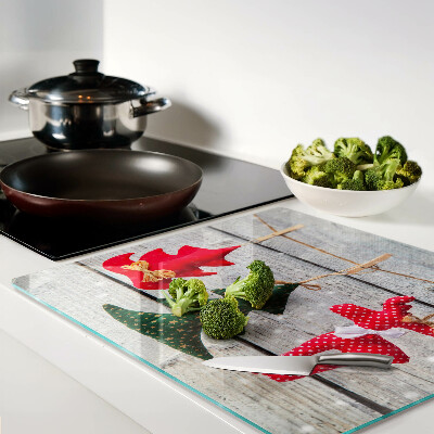 Tábua para cozinha Decorações de Natal em um fundo de madeira