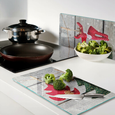 Tábua para cozinha Decorações de Natal em um fundo de madeira