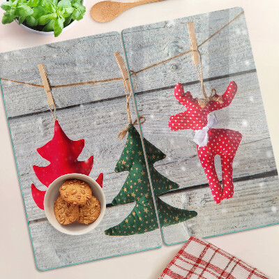 Tábua para cozinha Decorações de Natal em um fundo de madeira