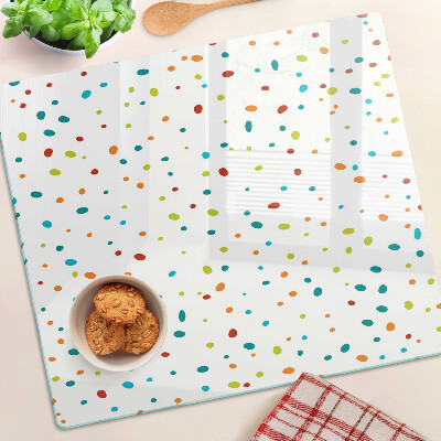 Tábua para corte Pontos coloridos em um fundo branco