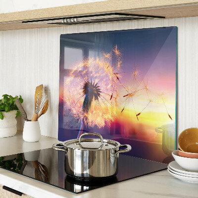 Tábua para cozinha Dentes-de-leão contra o fundo do pôr do sol