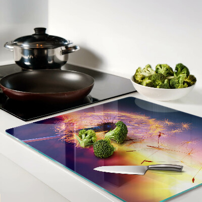 Tábua para cozinha Dentes-de-leão contra o fundo do pôr do sol