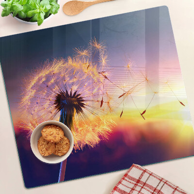 Tábua para cozinha Dentes-de-leão contra o fundo do pôr do sol