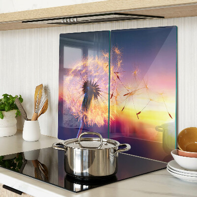 Tábua para cozinha Dentes-de-leão contra o fundo do pôr do sol