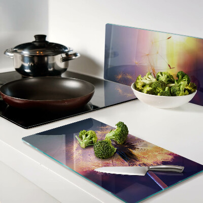 Tábua para cozinha Dentes-de-leão contra o fundo do pôr do sol